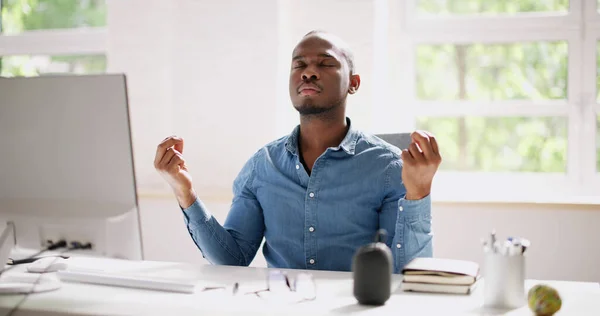 African Employee Doing Mental Health Yoga Meditation In Office