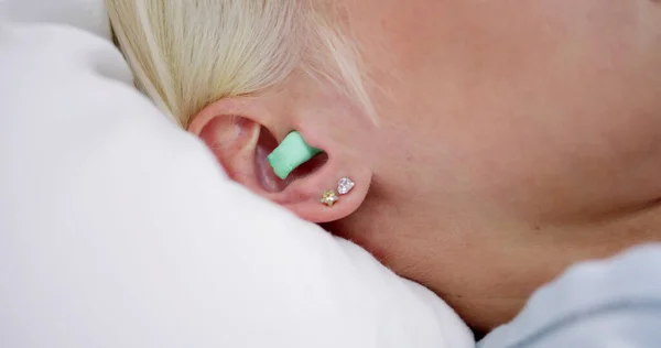 Woman Sleeping Earplugs Her Ears Bed — Stock Photo, Image