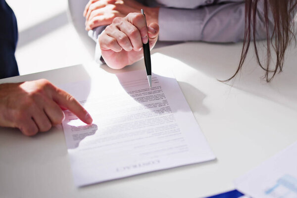 Lawyer Hand Document Review And Contract Mediation