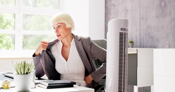 Electric Ventilator Fan In Hot Office Blowing Cool Breeze