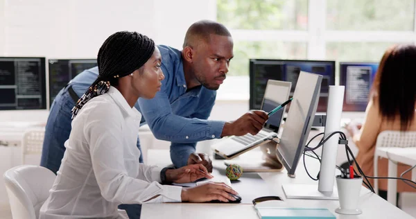 African Business Team Working On Computer. Software App Development