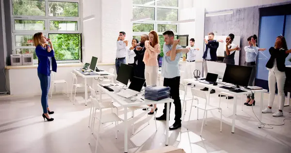 Corporate Yoga Near Business Desk. Diverse Group Workout