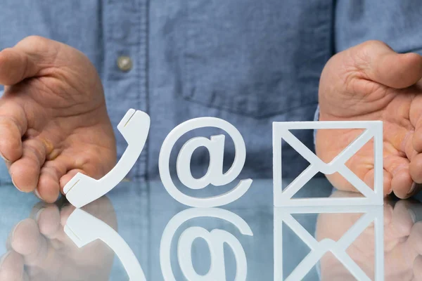 Contact Methods Presented By Man. Close-up Of A Phone, Email And Post Icons