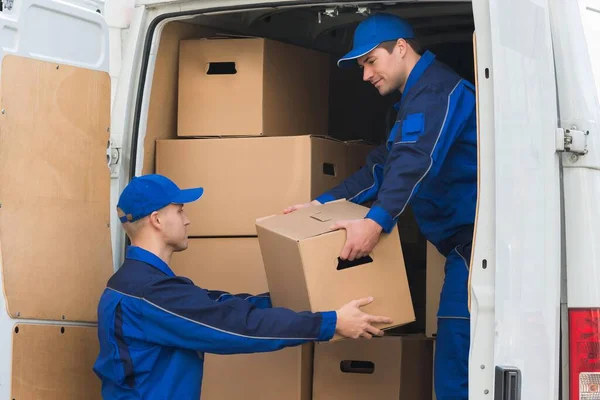 Young Delivery Men Unloading Cardboard Boxes Truck — Stock Photo, Image