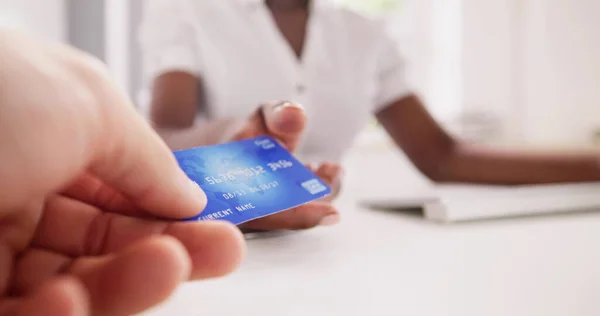 Cashier Hand Holding Debit Or Credit Card. Money Transaction