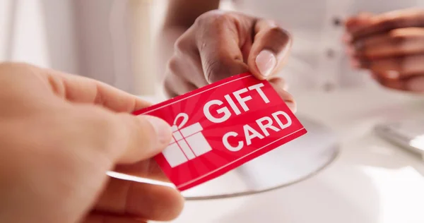 Holding Giving Gift Card Voucher Ticket — Stockfoto