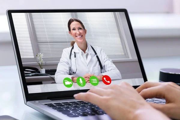 Online Video Conference Call With Doctor On Laptop