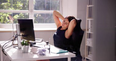 Advisor Woman Relaxing In Office Chair At Desk