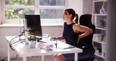 Back Pain Bad Posture Woman Sitting In Office clipart