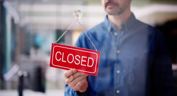Male Owner Changing Closed Sign His Store — Stock Photo, Image