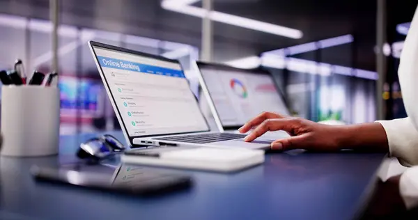 stock image Digital Banking: African American Woman Opens Online Bank Account, Tracks Invoices, and Manages Finances in Home Office