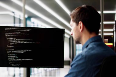 Web Developer Looking At Code. Computer Database Software Programming