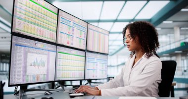 Hospital Doctor Using Spreadsheet For Billing Codes On Desktop