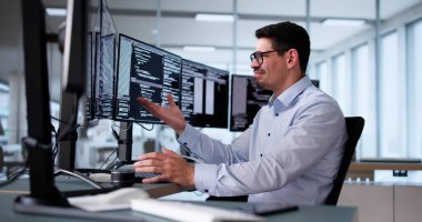 Unhappy Sad Developer Programmer Man In Stress Coding Software On Computer