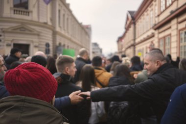 Cacak, Serbia - January 26, 2025: Protests in Serbia regarding the fall of a concrete canopy in Novi Sad where 15 people died. Citizens demand that the authorities take responsibility and punish those responsible for that event. clipart