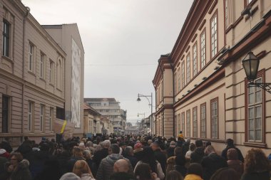 Cacak, Serbia - January 26, 2025: Protests in Serbia regarding the fall of a concrete canopy in Novi Sad where 15 people died. Citizens demand that the authorities take responsibility and punish those responsible for that event. clipart