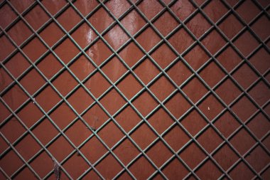 Ahşap bir duvardaki metal ahşap parmaklıklar, soyut kompozisyon..