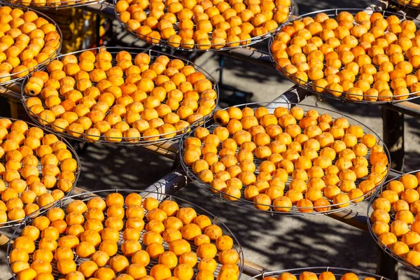 Dry Persimmon fruit production under sunshine in factory