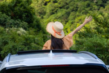 Woman enjoy her road trip