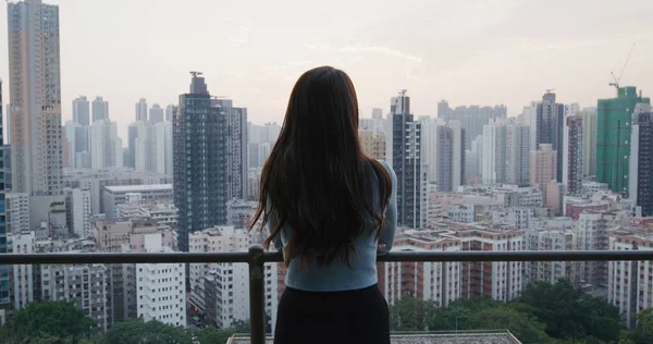 Woman look at the city scenery view in the evening