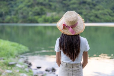 Woman look at the lake over the mountain