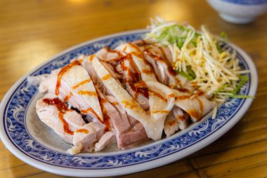 Cold steamed chicken dish in restaurant