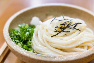 Cold Japanese Udon dish in restaurant  clipart