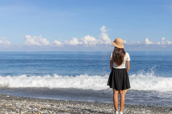 stock image Woman look at the sea beach