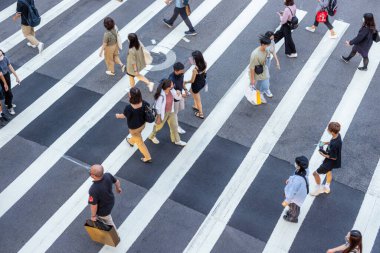 Taipei, Taiwan - 28 July 2022: Top down view of people cross the road