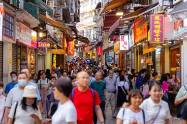 Macau - 03 July 2023: Crowded of people walk in the tourist landmark 