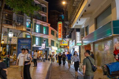 Macau - 03 July 2023: Crowded of people walk in the tourist landmark 