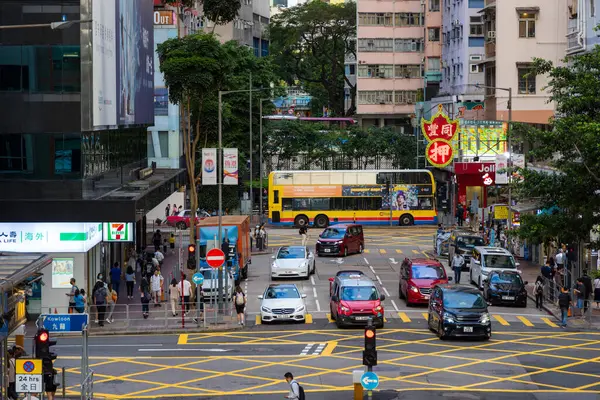 stock image Hong Kong - 20 June 2023: Hong Kong city with pedestrian cross the road in causeway bay district