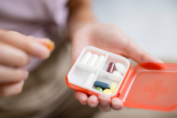 Pill box with medications and nutritional supplement