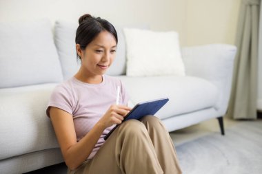 Woman use tablet computer at home