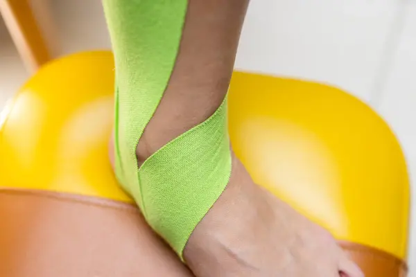 Elastic therapeutic tape on the foot