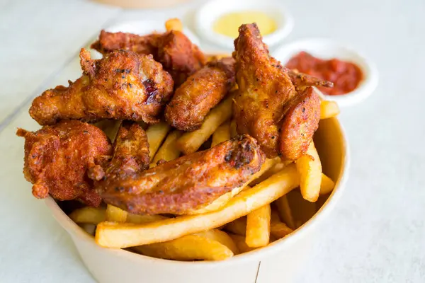 Deep fried chicken with fries