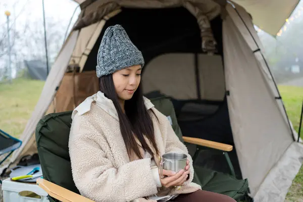 Woman go camping site in the winter time