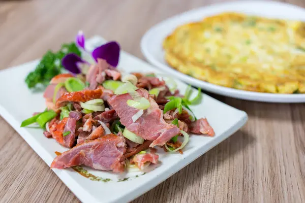 Smoked duck meat with egg omelette