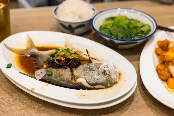 Steamed fish with soy sauce in Hong Kong cuisine restaurant