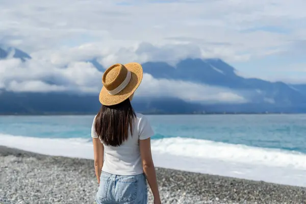 stock image Woman enjoy the scenery view of the sea beach