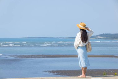 Tourist woman look at the sea