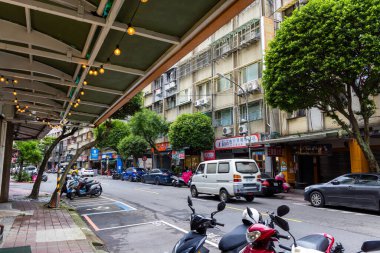 Taiwan 07 November 2024: Urban Street Scene with Trees and Traffic Lights in Taiwan clipart