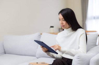 Woman use tablet computer at home