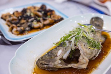 Fresh steamed fish served on plate
