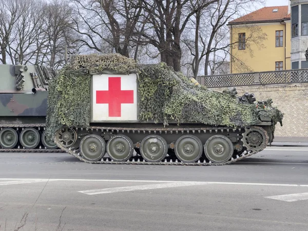 Latvia, Riga. Military camouflage ambulance on a crawler at the parade in honor of the independence of Latvia.