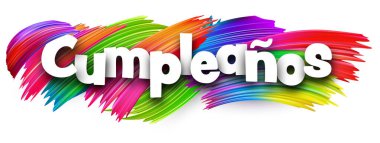 İspanyolca kelime, parlak çoklu renk fırça darbeleri üzerine kalın beyaz harflerle doğum günü anlamına gelir.