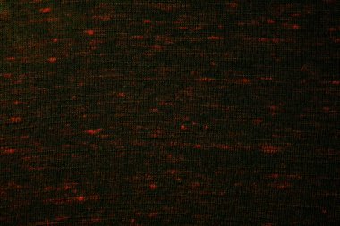 Koyu renk örülmüş kumaş, ince kırmızı benekler ve tırtıklı bir doku. Tekstil, moda veya kumaş desenleri için ideal.
