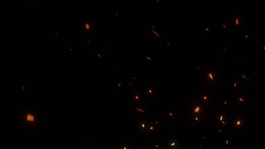Siyah zemin üzerinde uçan ateş parçacıkları izole edildi