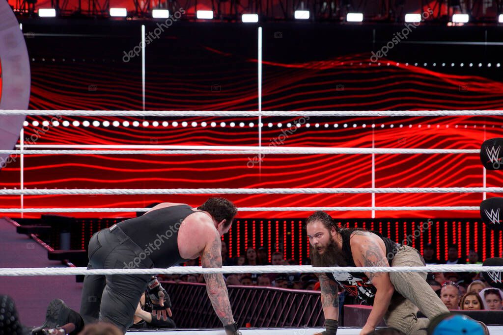 Santa Clara, California - March 29, 2015: WWE Wrestler the Undertaker stares across at Bray Wyatt on the floor of the ring during match at Wrestlemania 31 at the Levi's Stadium.