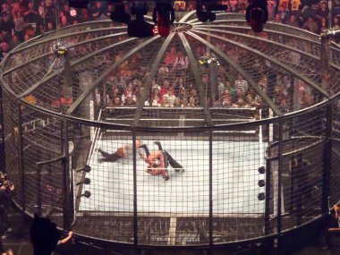 Oakland, California - February 20, 2011: Rey Mysterio puts Edge in a pinning position as the referee counts during the Elimination Chamber match at Oracle Arena. clipart